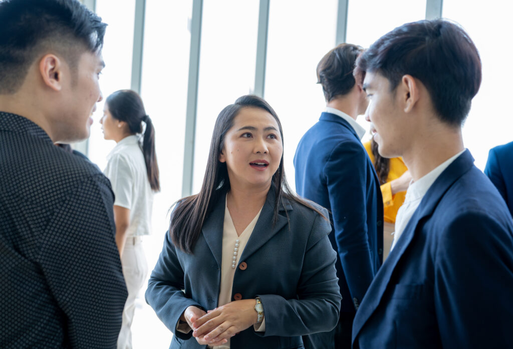 Business professionals interacting with each other during a networking event.