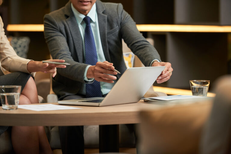 Two business professionals having a meeting in a cozy office environment.
