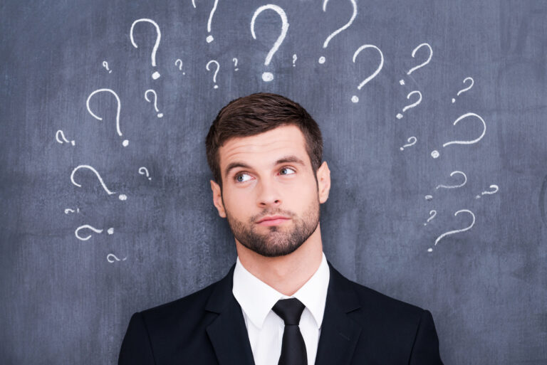 A young professional with a big question mark drawn in his background.